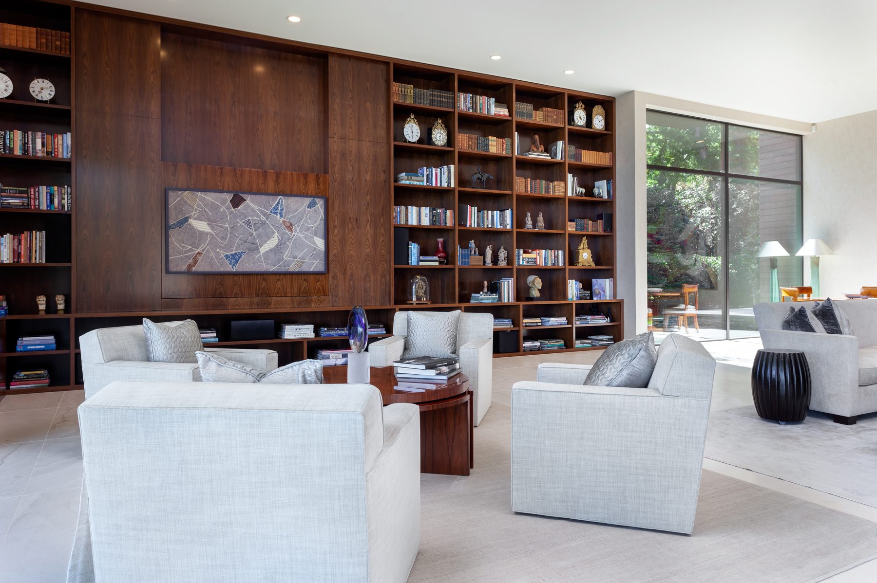 Living room with a TV that hides behind art