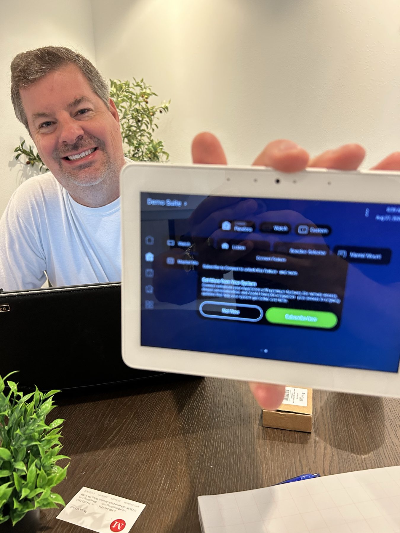 Daisy technician with a smart home control tablet