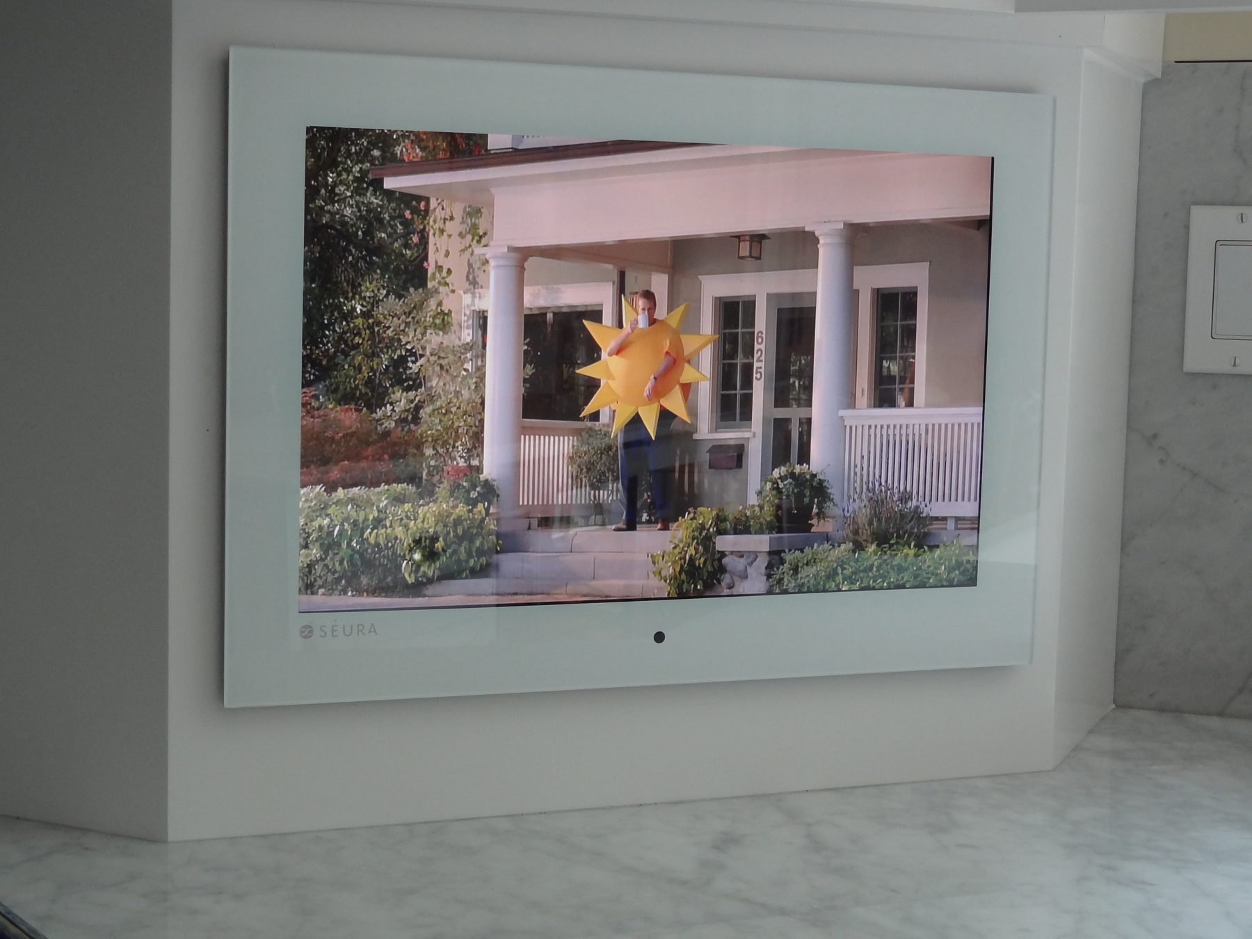 Kitchen TV framed in millwork